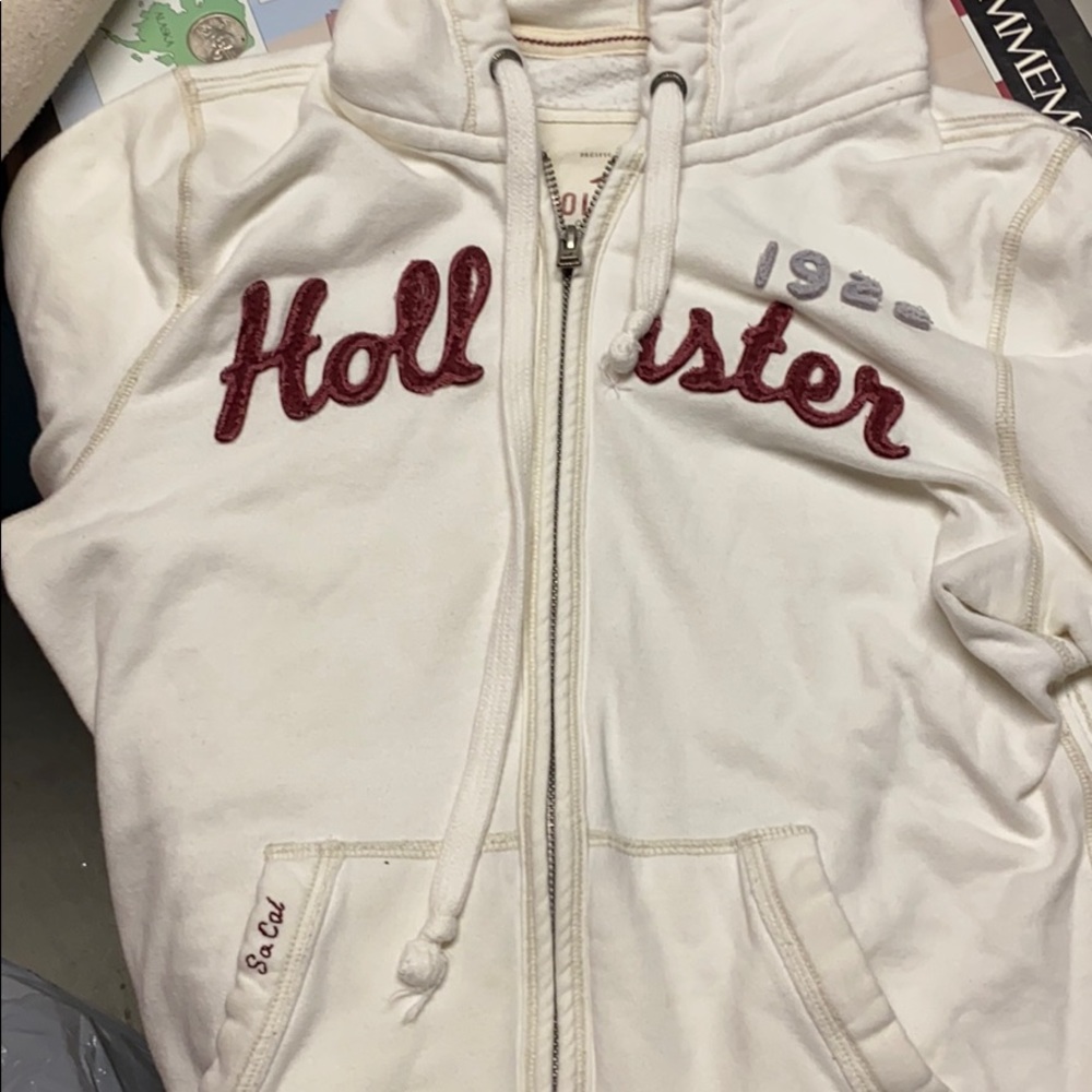 Cream colored hollister hooded zip up sweatshirt